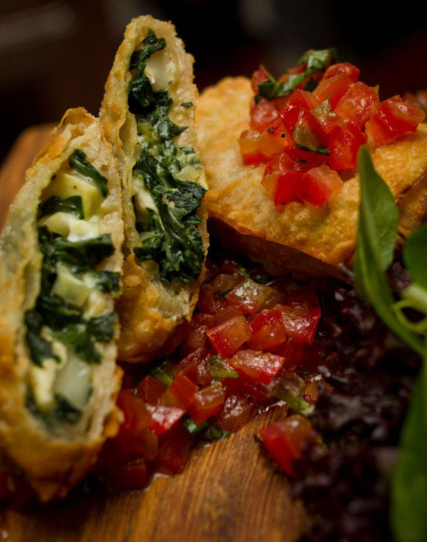 Cornish goats' cheese and spinach filo pastry parcels served with English heritage plum tomato concase and herb salad at Putney Pies