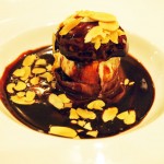 Profiteroles with chocolate sauce and almond flakes at The Lawn Bistro