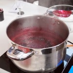 Blackcurrant and chilli jam bubbling in pan, jam making with Vivien Lloyd