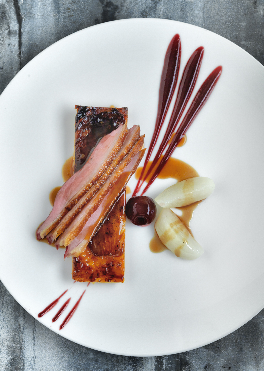 Breast of duck with a tarte fine of caramelised endive and cherry puree