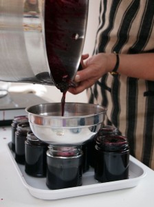 Pouring jam into jars, jam making with Vivien Lloyd