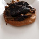 Mushroom, onion, pine nuts and sausage pizza at Mallorca Week, Boqueria, Brixton