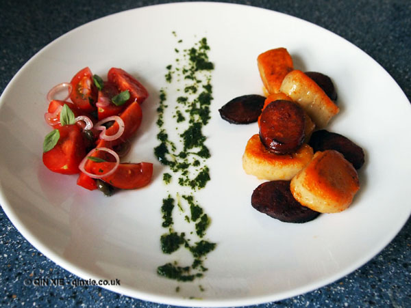 Potato gnocchi with chorizo, basil oil and tomato salad