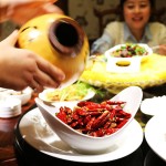 Dry fried chicken with chillies served in a gourd, Kuan Alley No 3, Chengdu, China
