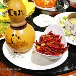 Dry fried chicken with chillies served in a gourd, Kuan Alley No 3, Chengdu, China