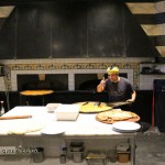 Chef at oven, Restaurante i Tre Merli Porto Antico, Genoa