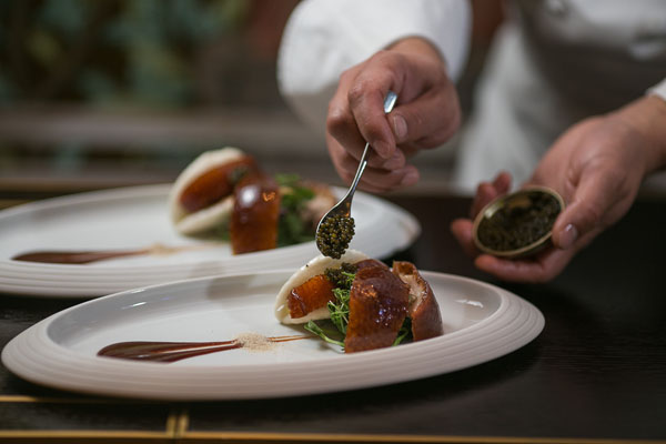 HKK's Cherry wood duck with mantou and caviar