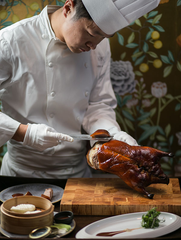 Chef carving cherry wood duck at HKK